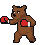 Brown bear in red boxing gloves throwing punches.