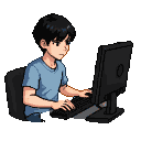 Young person with short dark hair playing on a computer, wearing a light blue t-shirt and dark pants.