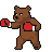 A brown bear wearing red boxing gloves, in an athletic stance, preparing to punch.