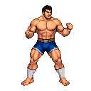 A muscular wrestler with dark hair and a mustache, wearing blue shorts and white leg wraps, stands in a fighting stance with clenched fists.