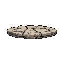 Weathered circular stone platform with deep fissures and cracks.