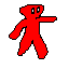 Red figure with wide white eyes, one arm extended forward, on black background.