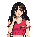 Young woman with long dark hair, blue eyes, and a gentle smile, touching her cheek. She wears a pink off-the-shoulder crop top.