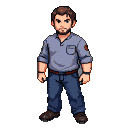 A man with short brown hair and a subtle beard, wearing a light blue collared shirt with rolled-up sleeves, dark blue jeans, and brown shoes.