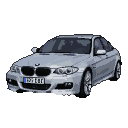 A silver BMW M5 sedan, head-on view, with illuminated headlights and wheels, on a black background.