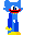 A blue, pixelated character with large white eyes, a wide red mouth filled with sharp black teeth, and yellow bow tie on a black background.