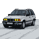 White 2004 BMW X5 E53 with illuminated yellow angel eyes on a snow-covered road at night.