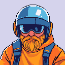 Character with orange beard, blue helmet and goggles, and orange hooded jacket with blue straps.