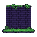 Dark purple brick wall with green foliage spilling over the top and grass at the base.